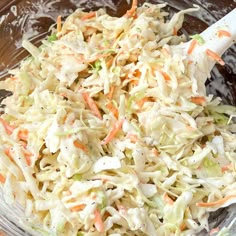 a bowl filled with coleslaw and carrots