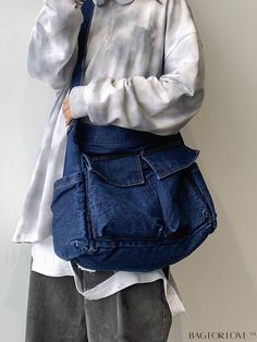 a person wearing a white shirt holding a blue bag and talking on a cell phone