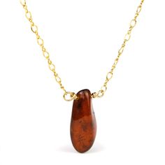 Amber Necklace On Gold Filled Chain With Gold Filled Trigger Clasp Approx. 18" long Bead Size Approx. 22mm x 10mm Amber is technically not a gemstone or mineral, but fossilized resin from prehistoric trees that has aged over the course of millions of years. As sticky resin oozed from ancient pine trees, small insects, plant material, feathers and other small objects in the path of the flow became entrapped; over time, these organic pollutants developed the varying colors and opacities in individ Prehistoric Trees, Baltic Region, Small Insects, Heart Problems, Amber Necklace, Small Objects, Pine Trees, Gold Filled Chain, Tuscany