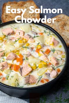 an easy salmon chowder recipe is shown in a bowl with bread on the side