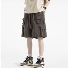 Take your wardrobe to the next level with these stylish Solid Multi-Pocket Cargo Shorts. Featuring multiple pockets for convenience, they offer an aesthetically pleasing accent to any outfit. With a wide range of sizes, they are perfect for a night out, casual event, or everyday use. Features: -100% Polyester -Mid-rise waist -Belted Waistband -Multi-Pocket -Solid Color -Regular Fit -Vintage style Baggy Cargo Shorts With Pockets For Summer, Utility Style Bottoms With Cargo Pockets, Utility Style Cargo Shorts, Utility Style Shorts With Cargo Pockets, High-waist Cargo Shorts With Pockets For Summer, Utility Cargo Shorts With Pockets, Summer Streetwear Cargo Pants With Pockets, Baggy Shorts With Pockets For Streetwear, Khaki Utility Bottoms With Pockets