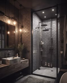 a bathroom with a brick wall and glass shower stall, sink, mirror, and rug