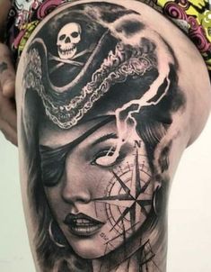 a woman with a pirate hat and compass tattoo on her thigh