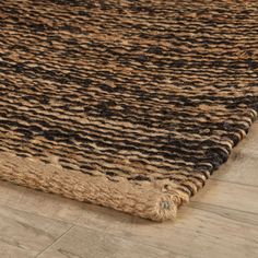 a brown and black rug on the floor