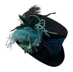 "Black 100% felt Top Hat with silk print textured band around the crown in turquoise.  There are beautiful turquoise and black flowers, along with turquoise and black ostrich feathers. The crown of the hat is lined in satin with a stretchy sweatband for a better fit.  #7853 Please measure your head before ordering. Returns are not accepted if you order the wrong size. Message me with any questions if you have any questions at all.  SIZES:  M     21 3/4\" - 22 1/4″               L     23\" - 23 1 Wedding Top Hat, Top Hats For Women, Edwardian Costumes, Special Occasion Hats, Hat With Flowers, Black Straw Hat, Steampunk Top, Mad Hat, Steampunk Top Hat