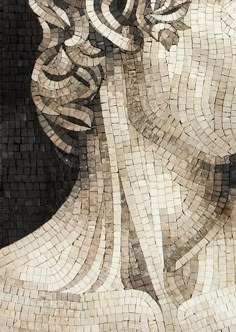 a woman's face is made out of small mosaic tiles