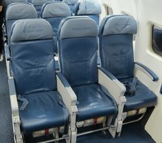 the seats on an airplane are empty