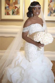 a woman in a wedding dress holding a bouquet