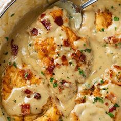 a skillet filled with chicken covered in gravy