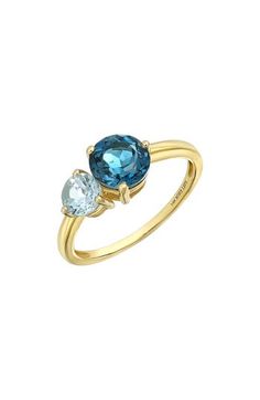 Two prong-set semiprecious stones bring vibrant sparkle to the center of this handcrafted 14-karat-gold ring and adds rich color to any stack. 1/2"W x 1/4"L setting Total stone weight: 1.43ct. 14k gold/blue topaz and peridot, blue topaz and citrine or blue topaz Imported Topaz And Citrine, Bony Levy, Stackable Ring, London Blue Topaz, London Blue, Womens Jewelry Rings, Stackable Rings, Blue Topaz, Prong Setting