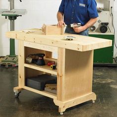 a man standing in front of a workbench