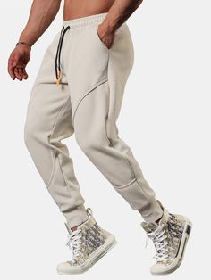 Elevate your athleisure game with our Cropped Joggers With Drawstrings. Crafted from premium polyester, these joggers provide a soft feel for all-day comfort. The cropped design adds a modern twist to your outfit, while the drawstring waist allows you to adjust the fit to your preference. Whether you're running errands or going for a jog, these joggers offer the perfect combination of style and functionality. Specifications: Material: Polyester Package included: 1*Pants Size Chart (inches): Size Sportswear Sweatpants With Drawstring For Gym, Stretch Sportswear Joggers With Drawstring, Solid Color Activewear With Drawstring For Jogging, Jogging Pants With Drawstring, Solid Color Sporty Joggers With Drawstring, Sportswear Sweatpants With Drawstring For Sports, Athleisure Jogging Pants With Drawstring, Athleisure Sweatpants With Drawstring For Sports, Urban Style Gray Joggers For Sports