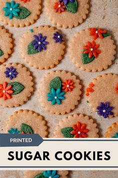 decorated sugar cookies with flowers and leaves on them are shown in front of the words, printed