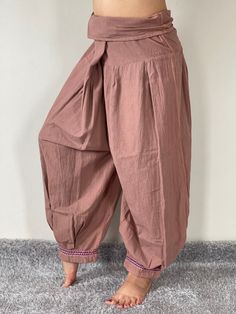 "Thai Hill Tribe FabricHarem Pants with Ankle Straps, Thai Ankle Straps pants, Harem pants, Hilltribe pants The perfect pair of pants for springtime. Super comfortable. Made from the highest quality Thai cotton with open-side legs and ankle cuffs with adjustable straps, you can move freely while practicing yoga, doing the split, or chasing your dreams. Be bold, be free, be beautiful, be bohemian. Suitable for both men and women. The elastic waist on the back allows the pants to fit most sizes. O Brown Bottoms For Festival, Traditional Style Baggy Pants For Spring, Traditional Baggy Pants For Spring, Traditional Baggy Bottoms For Spring, Bohemian Harem Pants With Tapered Leg, Traditional Ankle-length Bottoms With Elastic Waistband, Traditional Harem Yoga Pants, Traditional Ankle-length Harem Pants With Elastic Waistband, Traditional Brown Bottoms For Summer