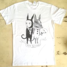 A t-shirt for Creatures, by Creatures.  Screen-printed. Black ink on white or green cotton. Sizing: size are unisex. The t shirts are made by Ascolour.  100% cotton.  Machine wash cold. Cotton T-shirt With Custom Artwork In Relaxed Fit, Cotton T-shirt With Custom Artwork And Relaxed Fit, White Cotton Shirt With Custom Artwork, Unisex Hand Printed Cotton T-shirt, Summer Unisex Hand Printed T-shirt, White Crew Neck T-shirt With Hand Printed Details, White Hand-printed Crew Neck T-shirt, White Hand Printed Organic Cotton Top, White Organic Cotton Hand Printed Tops