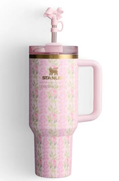 a pink coffee cup with a handle on it