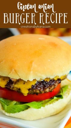 a cheeseburger with lettuce and tomato on it is sitting on a plate