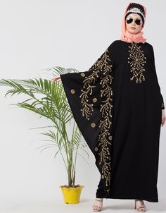 Exclusive designer Abaya for party and casual wear Black fabric with Black fully embroidered butterfly sleeve Two utility pocket at side seam Right one for exclusive look and left is normal bell Embroidered sleeve, Round neck and flare bottom pull from neck to wear Hijab and band shown in the image can be bought separately Fabric: 100% Polyester Crepe ( Matt Finished Nida)Care: Mild machine wash/ hand Cold Wash/ Dry cleanWe request customers to carefully choose the correct size and dress length Party Abaya, Designer Abaya, Embroidered Butterfly, Butterfly Sleeve, Butterfly Sleeves, Wearing Black, Black Fabric, Dress Length, Dubai