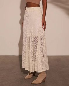 Embrace your free-spirited style with the Sundrenched Lace Maxi Skirt, a dreamy piece that captures the essence of New Boheme. This skirt features a lightweight lace fabric overlay that flows effortlessly with every step, creating a romantic silhouette perfect for sun-soaked days. The elastic waistband offers comfort a Lace Patchwork Skirt For Spring, Chic Spring Maxi Skirt With Lace Trim, White Delicate Lace Skirt For Summer, Summer Lace Patchwork Skirt, Summer Skirt With Lace Patchwork, Chic Lace Maxi Skirt With Lace Trim, Feminine Delicate Lace Bottoms For Summer, Chic Lace Patchwork Skirt, Feminine Summer Bottoms With Delicate Lace