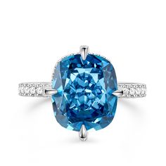 a blue diamond ring with diamonds around it