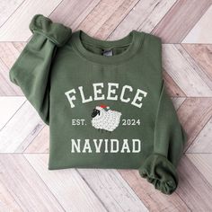 Fleece Navidad Funny Sheep Christmas Sweatshirt Baah-lieve it or not, this "Fleece Navidad" sweatshirt is the perfect blend of cozy and comical. Featuring a playful sheep design and a punny holiday twist, this sweatshirt is sure to bring laughs and warmth to the season. Crafted from soft, comfortable materials, it's ideal for lounging around the house or attending festive gatherings. Spread some woolly cheer with this unique and fun Christmas sweater.  - Unisex sizing  - Fits true to size for mo White Fleece T-shirt For Winter, Holiday Cotton Sweatshirt With Letter Print, Cozy Christmas Crew Neck Sweater, Cozy Christmas Sweater With Crew Neck, Cozy Christmas Sweatshirt With Relaxed Fit, Winter Crew Neck T-shirt Relaxed Fit, Cozy Relaxed Fit Christmas Sweatshirt, Winter Relaxed Fit Crew Neck T-shirt, Relaxed Fit Crew Neck T-shirt For Winter