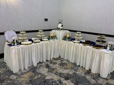 a banquet table with many different desserts on it