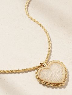 Established's fine jewelry is thoughtfully designed to encourage self-expression and empowerment. Handmade from 18-karat gold, this necklace is strung with a pavé diamond-encrusted heart pendant, which is framed by a rope-inspired trim to match the 18-inch chain. Wear yours solo or layered with shorter styles from the label. Luxury Heart Cut Necklaces With Pave Setting, Luxury Heart Cut Necklace With Pave Setting, Luxury White Necklace For Valentine's Day, Luxury White Double Heart Jewelry, Luxury Diamond Pendant Necklace For Valentine's Day, White Heart Pendant Necklace With Pave Setting, Luxury Valentine's Day Diamond Pendant Necklace, Luxury Heart Shaped Jewelry With Pave Setting, Luxury Heart-shaped Jewelry With Pave Setting