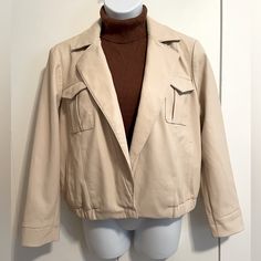 Takes Me Back To The 80’s Color Falls Between Cream And Tan. Single Snap Button At The Waist. Four Pockets. (Turtleneck In Picture Sold Separately). Classic Beige Collared Cropped Jacket, Beige Classic Collared Cropped Jacket, Beige Collared Classic Cropped Jacket, Beige Leather Jacket With Button Closure For Fall, Beige Casual Leather Jacket With Button Closure, Cream Cropped Jacket For Workwear In Fall, Beige Casual Leather Jacket For Work, Casual Beige Leather Jacket For Work, Spring Beige Leather Jacket With Button Closure