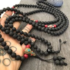 Everyday black lava stone mala necklace. You can choose between 2 styles. 1- A Mala necklace that is all black lava stones which is 43cm- 17 inch long (there is no clasp, you wear it over the head) 2-A Mala necklace which has black lava stones, red beads and unique Nepali beads. This Mala is 48cm- 19 inch long ( there is no clasp, you wear it over your head) This unique unisex mala necklaces can be a diffuser necklaces also, as you can choose which ever oil that you like to use with the lava roc Black Spiritual Necklace For Meditation, Spiritual Black Necklace For Meditation, Black Spiritual Necklaces With Natural Stones, Black Necklaces With Natural Stones For Meditation, Spiritual Black Beads Mala For Meditation, Adjustable Black Beaded Necklace For Meditation, Black Gemstone Beads Necklace For Meditation, Black Natural Stones Jewelry For Meditation, Black Crystal Necklaces With Round Beads For Meditation