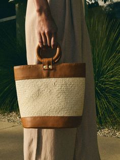 Meet the bag of the season, handmade in Peru by local artisans in a woman-owned factory. We added an effortless ring handle and an easy zip closure so you can keep your stuff safe (you're welcome). (This one comes in Desert Brown/Natural.) * All pieces are subject to slight differences in shape, size, and color, which are natural (and part of the charm) of a handmade product. Measurements:- Top Opening = 11 1/2"- Bag Height = 9"- Base Width = 5"- Base Length = 8" | Bonnie Bag in Desert Brown Nat Artisan Bucket Bag For Everyday Use In Summer, Ethically Sourced Summer Tote Bag, Summer Ethically Sourced Tote Bag, Ethically Sourced Bags For Vacation, Everyday Summer Bag Ethically Sourced, Artisan Bags For Everyday Summer Use, Artisan Summer Bags For Everyday Use, Artisan Bags For Summer, Ethically Sourced Tote Bags