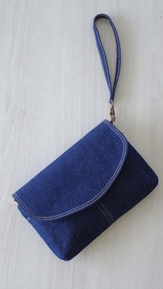 a small blue purse sitting on top of a white table