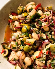 a white bowl filled with lots of food