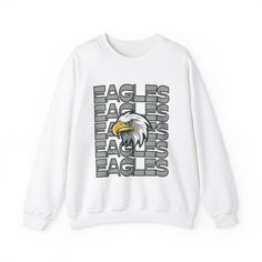 Eagles Mascot Sweatshirt Description: Show your school spirit with the Eagles sweatshirt! Ideal for any situation, this unisex heavy blend crewneck sweatshirt offers pure comfort and style. Made from a perfect blend of 50% cotton and 50% polyester, this sweatshirt ensures your designs look fresh and beautiful. Features: Comfortable Fabric: The medium-heavy fabric blend feels cozy, making it the perfect choice for those colder months. Durable Design: Double-needle stitching at the shoulder, armho White Long Sleeve Sweatshirt With School Spirit, White Oversized Sweatshirt With School Spirit, Pre-shrunk Crew Neck Sweatshirt For School Spirit, College Fan Apparel Sweatshirt With Graphic Print, White Pre-shrunk Sweatshirt For Streetwear, White Sweatshirt For Streetwear, College Fan Apparel Sweatshirt With Logo Print, School Spirit Graphic Print Sweatshirt With Relaxed Fit, White School Spirit Sweatshirt For Streetwear