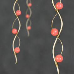 "The wiring earrings are handmade using 14k gold filled wire and pink coral. Free US shipping. Perfect gift for any occasions. Linear long earrings draws attention along vertical lines, visually elongating the face length, increase your height. In art, serpentine line is called\"The Line of Beauty\". S curves modulate from one gradient to another. S curves signify liveliness and activity and excite the attention of the viewer. This design is inspired by Rococo style, which is elegant, playful an Pink Wire Wrapped Copper Jewelry, Pink Copper Wire Wrapped Jewelry, Pink Wire Wrapped Copper Wire Jewelry, Elegant Rose Gold Earrings With Copper Wire, Handmade Pink Copper Wire Jewelry, Adjustable Wire Wrapped Rose Gold Earrings, Adjustable Rose Gold Wire Wrapped Earrings, Rose Gold Wire Wrapped Copper Wire Earrings, Rose Gold Wire Wrapped Earrings In Copper