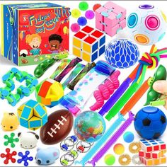 toys and games for children to play with in the classroom or at home, including cubes, balls, pens, pencils, markers, etc