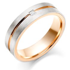 a white and yellow gold wedding ring with a princess cut diamond on the center, set in two tone gold