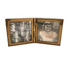 an old photo frame is open to show two people and one child in the background