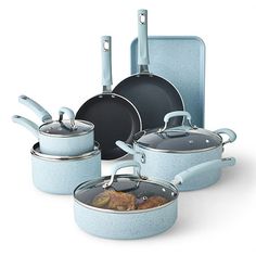 an assortment of pots and pans with lids