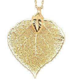 a gold plated necklace with a large leaf on the front and back of it