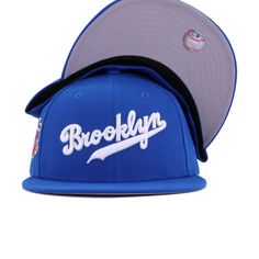 New Era Cap 59Fifty fitted hat for the Brooklyn Dodgers in custom blue colorway, featuring Jackie Robinson 50th Anniversary side patch. Celebrate baseball's greatest players with this exclusive Dodgers fitted from Hat Heaven! Featuring sparkling Blue Azure polyester, this is one of the finest pieces of headwear you could put on your body. Wordmark logo is the cherry on top for a irresistible modern classic. Hat Material: 100% PolyesterCrown: Blue AzureVisor: Blue AzureButton: Blue AzureUnderviso Red Snow, Brooklyn Dodgers, Wordmark Logo, Dodger Blue, Radiant Red, World Baseball Classic, Jackie Robinson, Word Mark Logo, San Diego Chargers