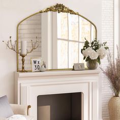 a mirror sitting on top of a mantle next to a fire place