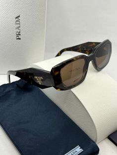 Brand new Prada PR17WS Sunglasses in Brown.Featuring a brown havana acetate frame with dark brown lenses.Gold metal Prada logos on temples.Size 49-20-145.100% authentic and unworn.Made in Italy.Box, case, cloth and paperwork included. Sold out everywhere. Designer Brown Tinted Sunglasses, Designer Brown Sunglasses With Mirrored Lenses, Designer Brown Sunglasses With Uva Protection, Luxury Brown Sunglasses With Uva Protection, Designer Brown Sunglasses With Uv Protection, Designer Brown Sunglasses With Polarized Lenses, Prada Sunglasses Aesthetic, Prada 17ws, Prada Sunglasses Women