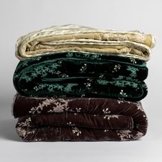 four blankets stacked on top of each other