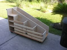 a wooden shelf sitting on top of a sidewalk