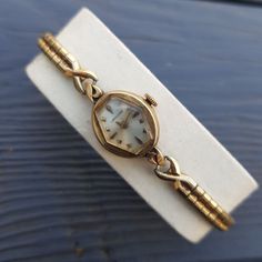 "Antique absolutely gorgeous ladies wrist watch by Longines. It features the original mechanical movement and dates back to the 1963. Watch features a Speidel stretchable band that forms to your wrist at almost any wrist size. The watch is marked on the back \"10K Gold Filled\". Movement: Longines Watch Co. Swiss Movement Serial Number:12476498. Jewels: 17j. Case: Longines - Wittnauer Watch Co. Inc. - New York - Geneva - Montreal - S&W.  Case Grade: 10K Gold Filled. Serial Number: 413349. Measures: 16 mm with crown. Weight: 0.4 oz. (12 grams). Vintage Longines watch is in good pre-owned condition. Not running. Very rare and collectible model. A perfect gift for women and a nice addition to any watch collection. A very scarce and beautiful time piece, your investment in this watch will neve Dior Watch, Ladies Wrist Watch, Art Deco Watch, Antique Costume Jewelry, Longines Watch, Vintage Watches Women, Antique Watches, Womens Watches Luxury, Jewelry Lookbook