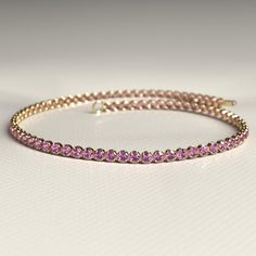 Add a touch of elegance to your collection with our 1.82 Carats Natural Pink Sapphire Tennis Bracelet, crafted in solid 14K/18K gold. This stunning piece showcases vibrant pink sapphires, making it a perfect September birthstone bracelet or a luxurious stacking piece. Ideal as a thoughtful Thanksgiving gift, this dainty bracelet is designed to celebrate special moments with timeless beauty. 𝐅𝐞𝐚𝐭𝐮𝐫𝐞𝐬: * 𝐌𝐚𝐝𝐞 𝐭𝐨 𝐎𝐫𝐝𝐞𝐫 * 𝐌𝐞𝐭𝐚𝐥: 𝟏𝟒𝐊 | 𝟏𝟖𝐊 * 𝐁𝐚𝐧𝐝 𝐂𝐨𝐥𝐨𝐫𝐬: Rose Gold, Yellow Gold & White Gold * 𝐀𝐩𝐩𝐫𝐨𝐱𝐢𝐦𝐚𝐭𝐞 𝐆𝐫𝐨𝐬𝐬 𝐖𝐞𝐢𝐠𝐡𝐭 - 1.65g * 𝐂𝐮𝐬𝐭𝐨𝐦 𝐂𝐫𝐨𝐜𝐨𝐝𝐢𝐥𝐞 𝐋𝐨𝐜𝐤 ★ 𝐏𝐥𝐞𝐚𝐬𝐞 𝐜𝐡𝐞𝐜𝐤 𝐭𝐡𝐞 𝐛𝐫𝐚𝐜𝐞𝐥𝐞𝐭 𝐰𝐢𝐝𝐭𝐡 𝐩𝐫𝐢𝐨𝐫 𝐭𝐨 𝐩𝐥𝐚𝐜𝐢𝐧𝐠 𝐲𝐨𝐮𝐫 𝐨𝐫𝐝𝐞𝐫. 𝐓𝐡𝐞𝐬𝐞 𝐛𝐫𝐚𝐜𝐞𝐥𝐞𝐭𝐬 𝐚𝐫𝐞 𝐝𝐚𝐢𝐧𝐭𝐲 𝐚𝐧𝐝 Sapphire Tennis Bracelet, Stacked Wedding Rings, Bracelet Stacking, Beauty Features, Surprise Her, Birthstone Bracelet, Dainty Bracelet, Sapphire Bracelet, Band Bracelet