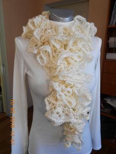 Milky white ruffle decorative scarf, hand knitted of ruffle acrilic yarn which brings a layered look. These textured waves look like the ruffles of a princess garment! This beautiful decorative lightweight wrap can be a nice part of any outfit. It also keeps you comfortable and warm. The scarf can be a nice Christmas gift for someone you love. Wonderful autumn wedding accessory. It is approximately 125cm/50inch in length and 10cm/4inch in width. I have other scarf options available in my store. White Hand Knitted Shawl For Winter, White Crochet Scarf One Size, White Hand-knitted Winter Shawl, White Hand Knitted Winter Shawl, White Shawl Scarves As Gift, Cream Hand Knitted Shawl For Winter, White Hand Knitted Scarf One Size, Winter Cream Hand Knitted Shawl, White Hand Knitted Scarf