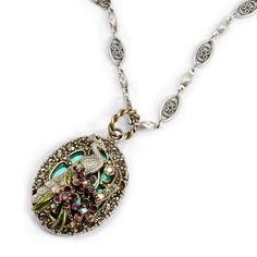 "Necklace: A graceful peacock stands in a marsh of aqua blue enamel and violet and purple flowers. Artistic and dimensional, the elements are layered in relief, each one detailed and hand finished. Flowers are set with starlight crystal. Border is set in smoke crystal. Delicate chain alternates oval fililgree links and tiny hexagons. Lobster claw clasp. Long necklace chain measures from 24\" to 27\" with included adjustable extender. Original design of Shelley Cooper. Manufactured at Sweet Roman Romance Jewelry, Gold Ring For Men, Mosaic Pots, Peacock Jewelry, Peacock Tail, Bijoux Art Nouveau, Vintage Peacock, Peacock Necklace, Peacock Theme