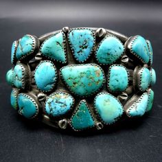 "VINTAGE NAVAJO BRACELET DESCRIPTION: This magnificent cuff features clustered cabs of old natural Morenci turquoise set in heavy gauge hand-stamped sterling silver. This bracelet will be a cherished addition to your collection of fine vintage Native American jewelry. MEASUREMENTS: Interior of the cuff measures 5 7/8\" with an additional 1 1/8\" non-adjustable gap. Total circumference: 7\" Measures 2 1/2\" straight across the widest part (from wrist bone to wrist bone) Bracelet face measures 2\" Jewlery Rings, Bone Bracelet, Morenci Turquoise, Bones Bracelet, Vintage Native American Jewelry, Vintage Silver Jewelry, Navajo Bracelet, Turquoise Jewelry Native American, American Indian Jewelry