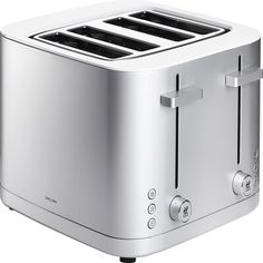 a silver toaster sitting on top of a white table